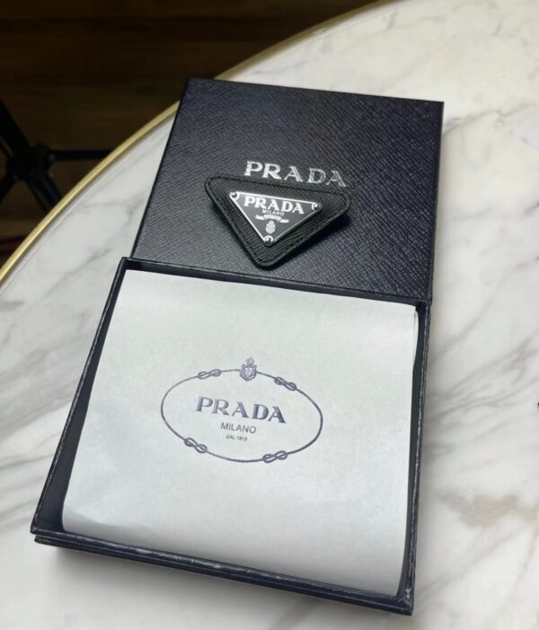 Prada brooch